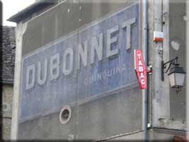 Dubonnet sign on wall across from the cafe