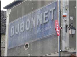 Dubonnet sign on wall across from the cafe