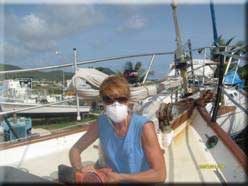 Diane sanding the teak